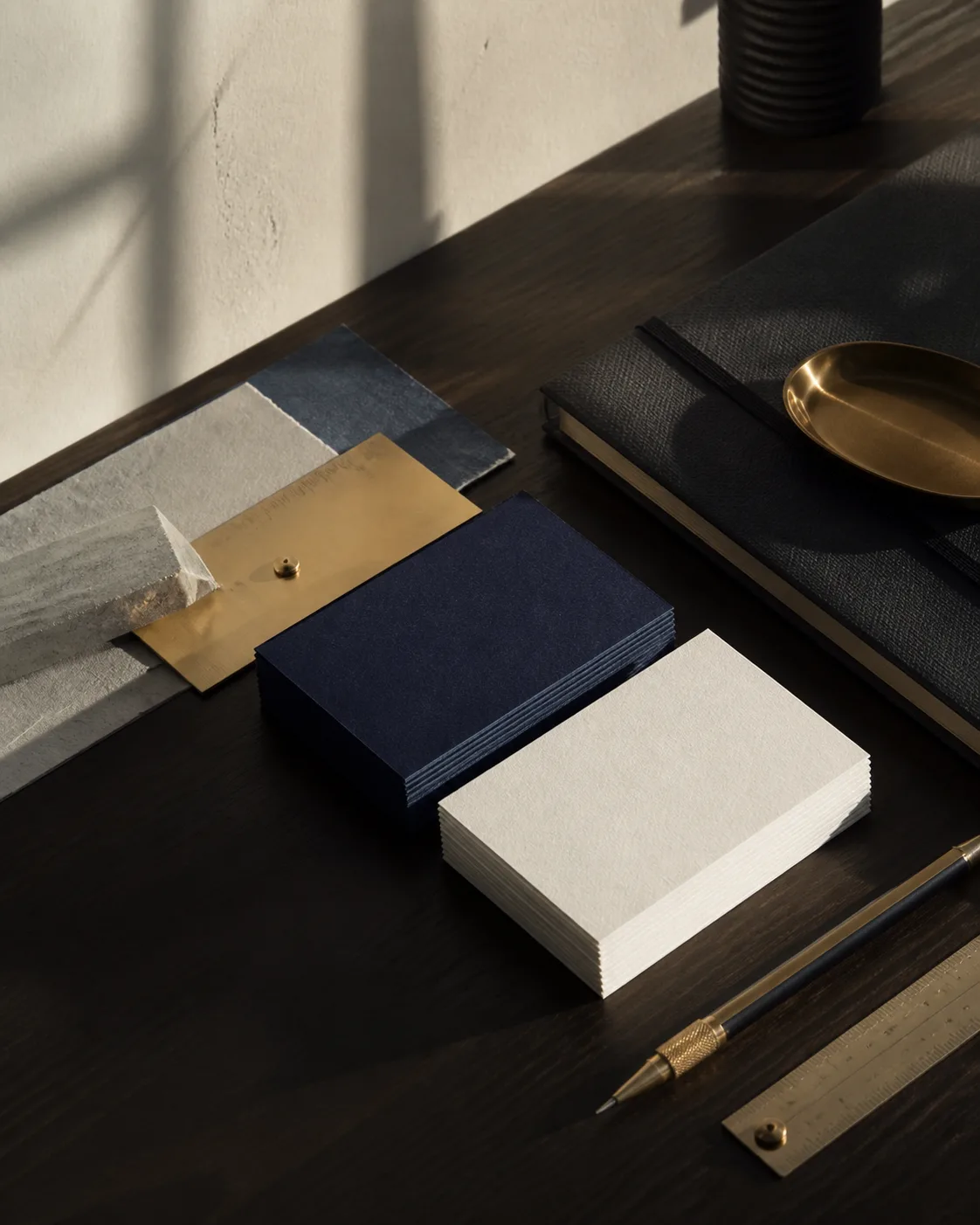Refined business stationery on a contemporary studio desk